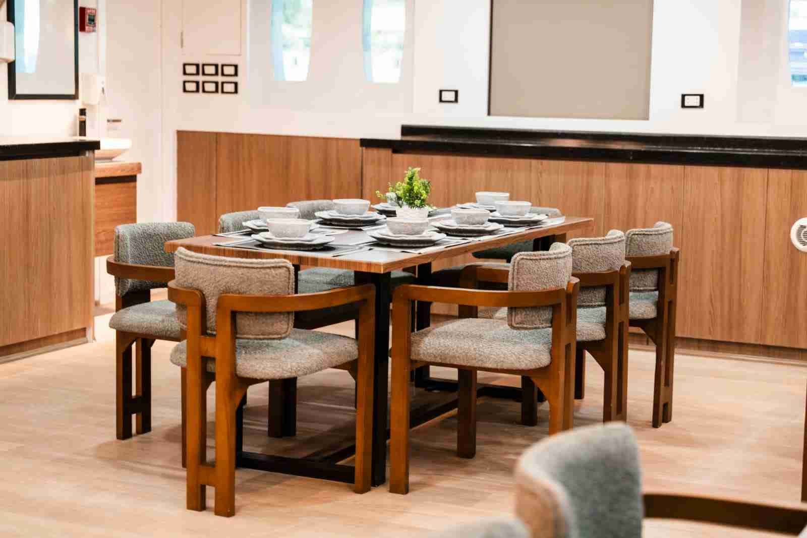 Salon and dining table laid for dinner on board a liveaboard