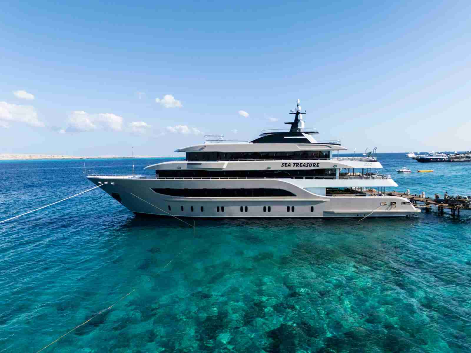 Sea Treasure liveaboard moored over a shallow Red Sea reef