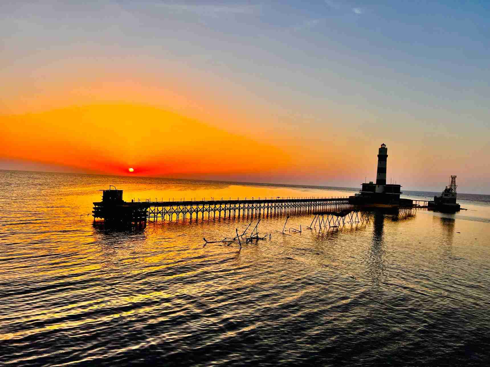 Lighthouse at sunset on the BDE liveaboard