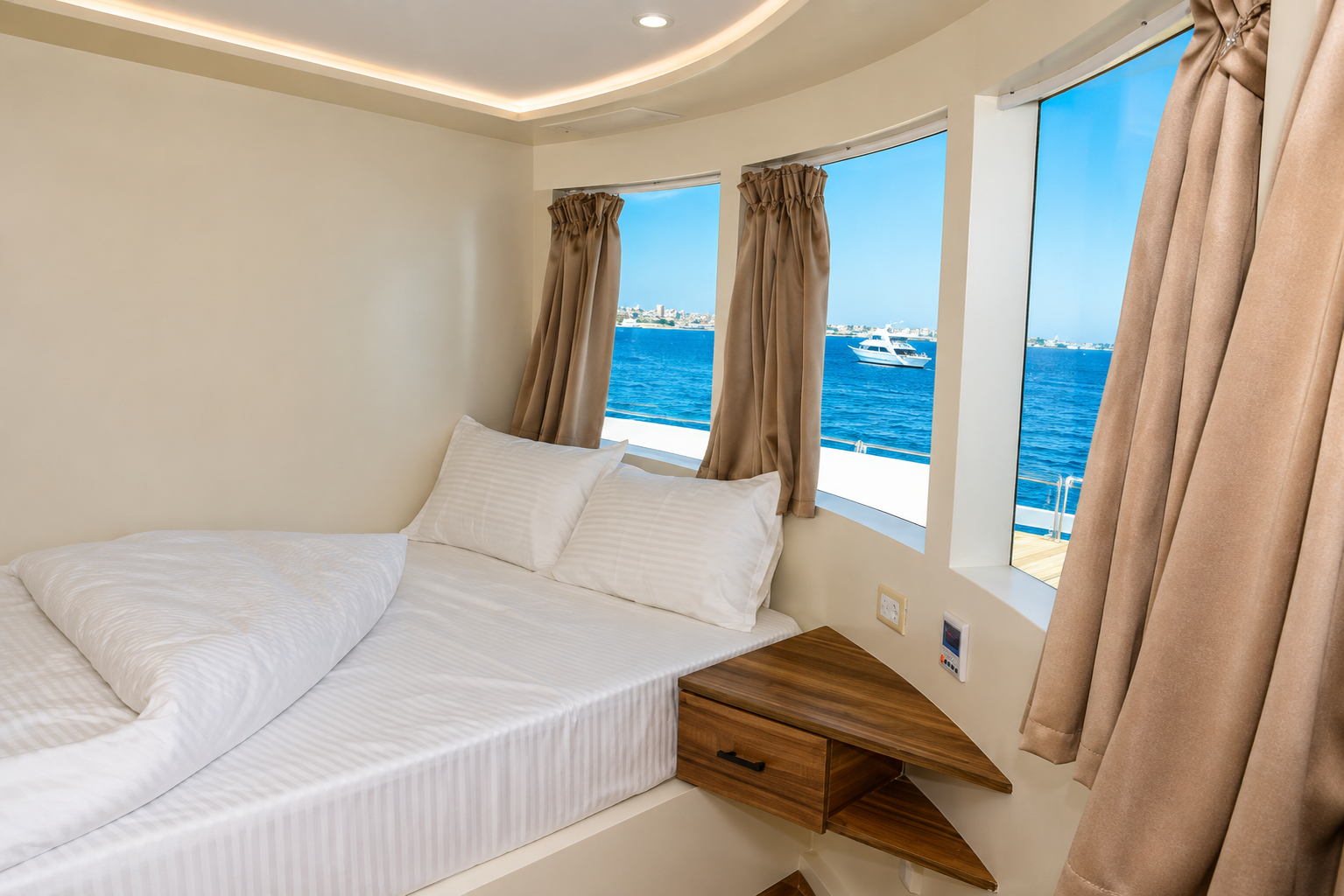 Bright double cabin with warm wood details and large sea-view windows