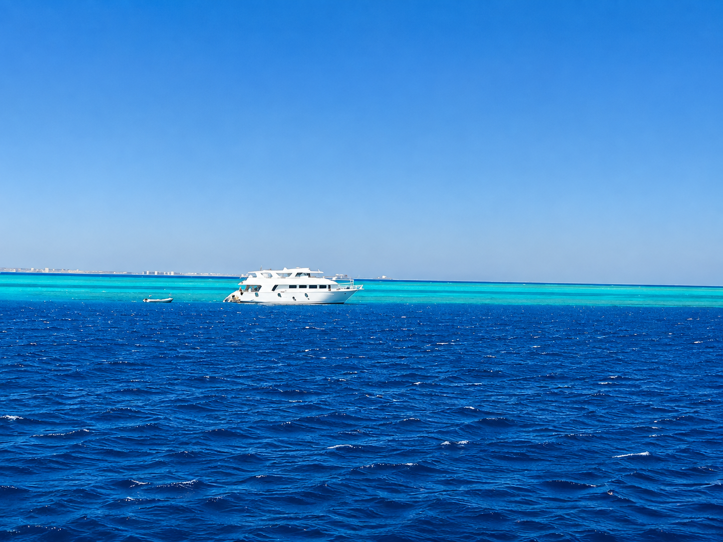 Fanadir Reef North and South with turquoise reef water meeting the deep blue Red Sea