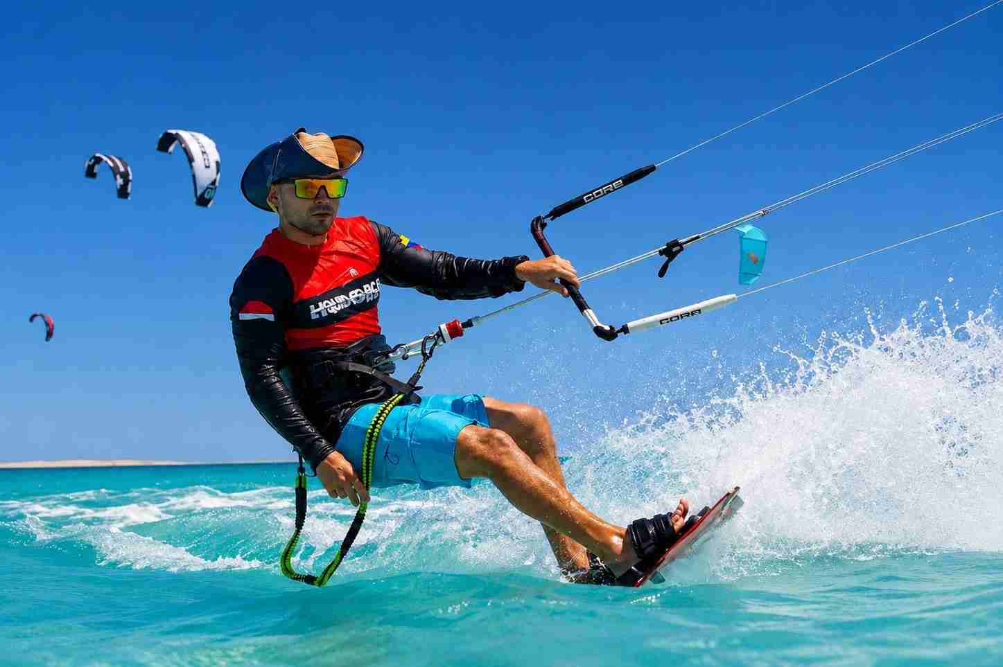 High-speed kitesurfing across clear turquoise water