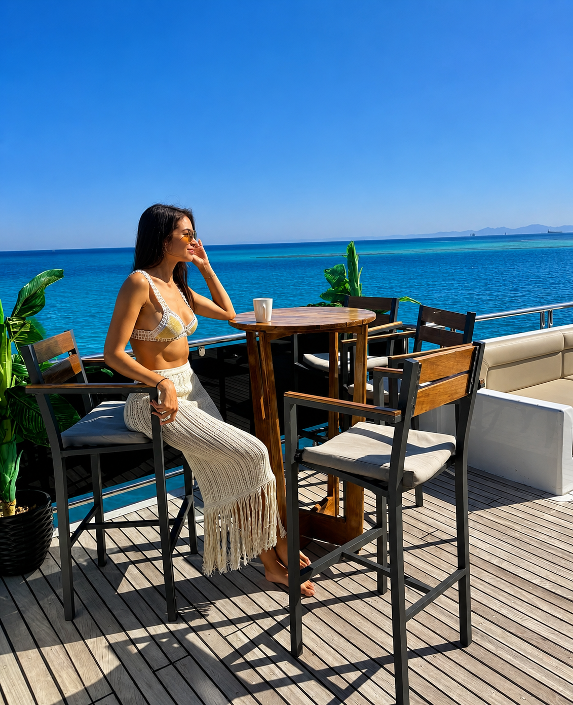 Guest relaxing on deck at sunset