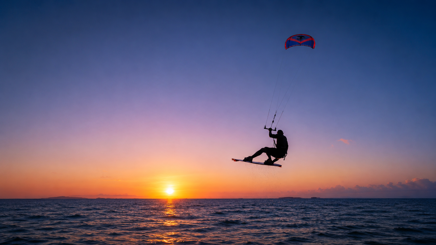 Inflated kitesurfing kite ready over shallow turquoise water at sunset