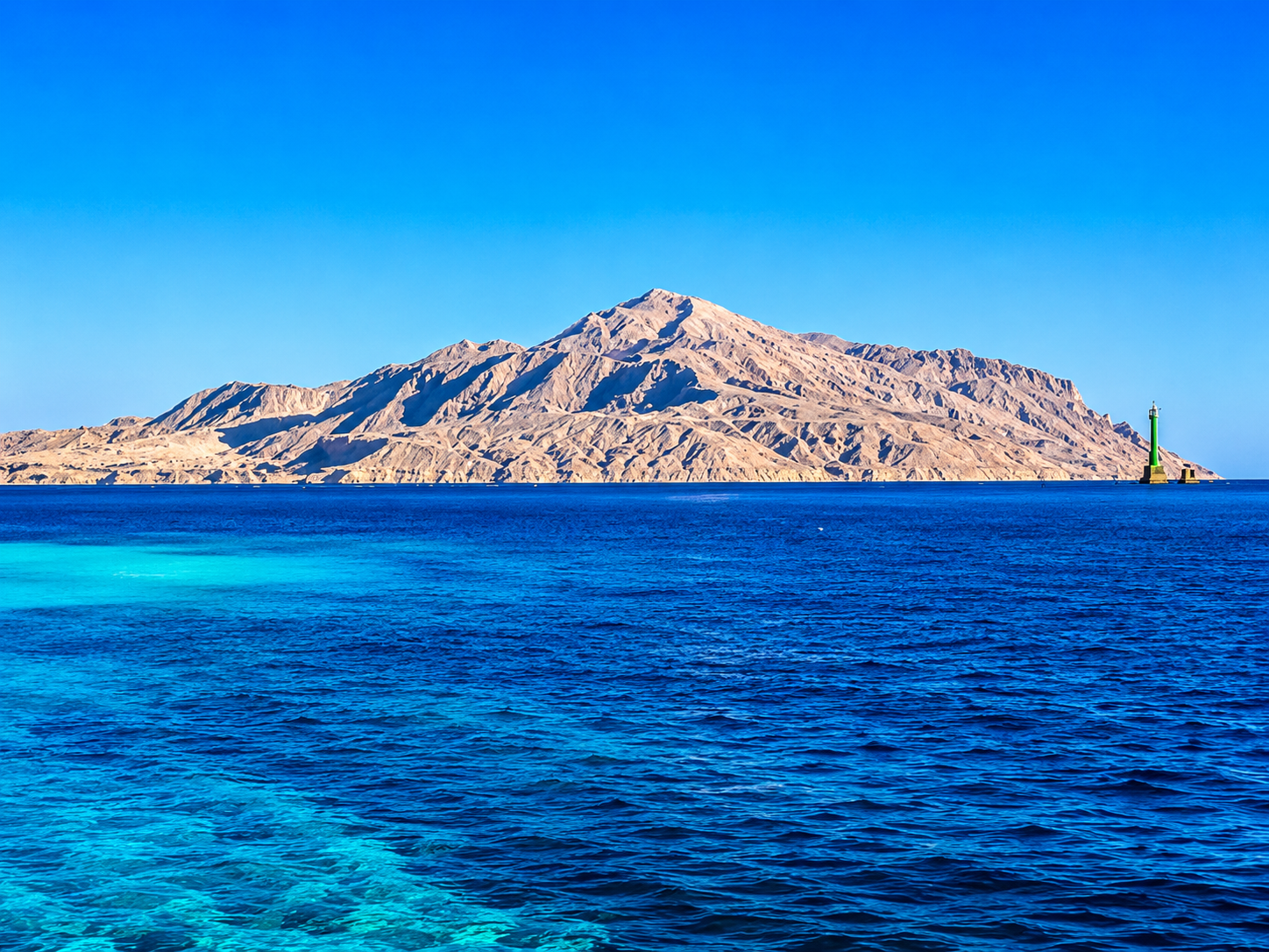 Tiran Island in the Strait of Tiran diving area near Sharm El Sheikh with its navigation beacon