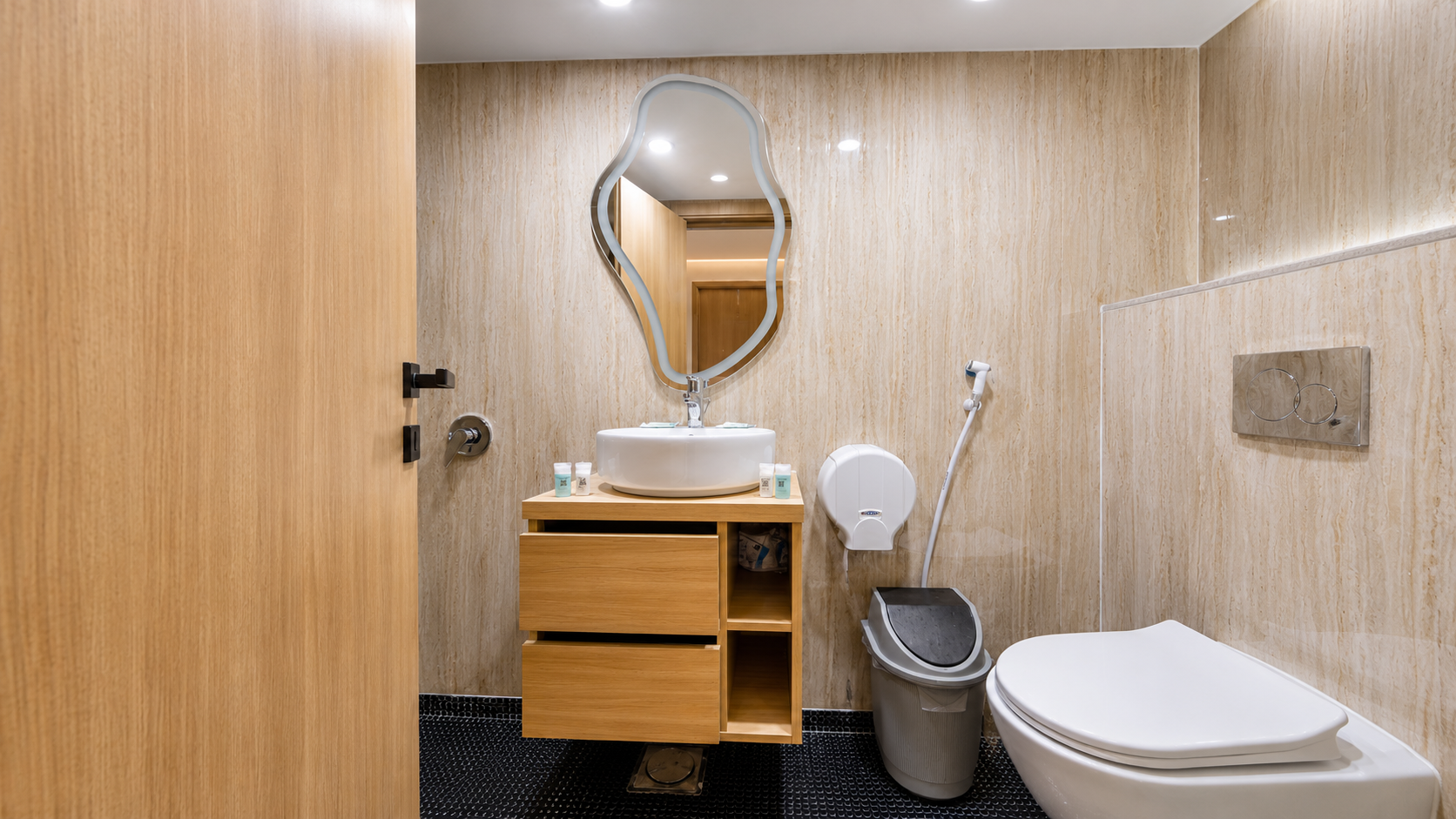 Private en-suite bathroom with a wooden vanity