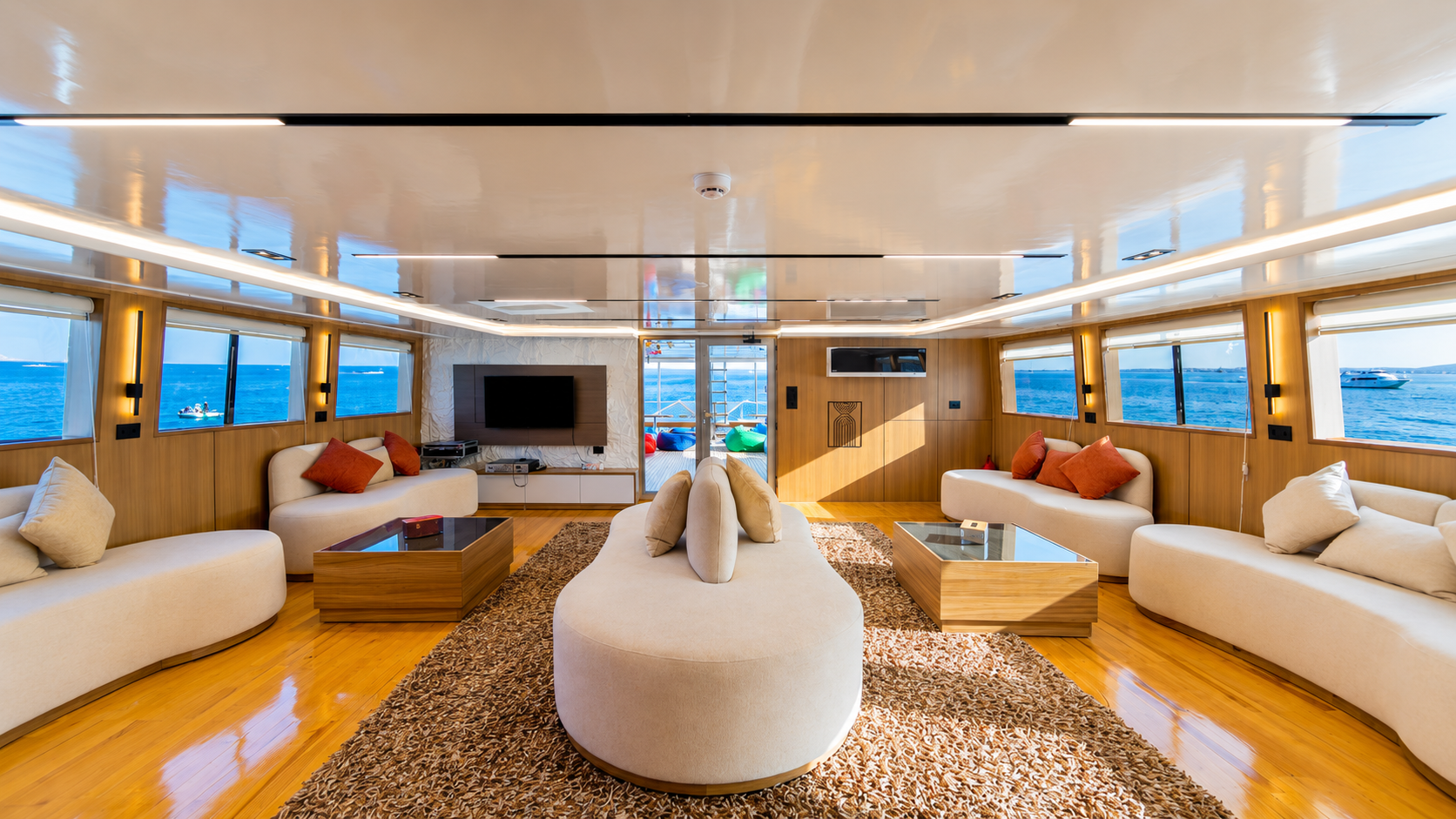 Air-conditioned salon with cream sofas and wide windows