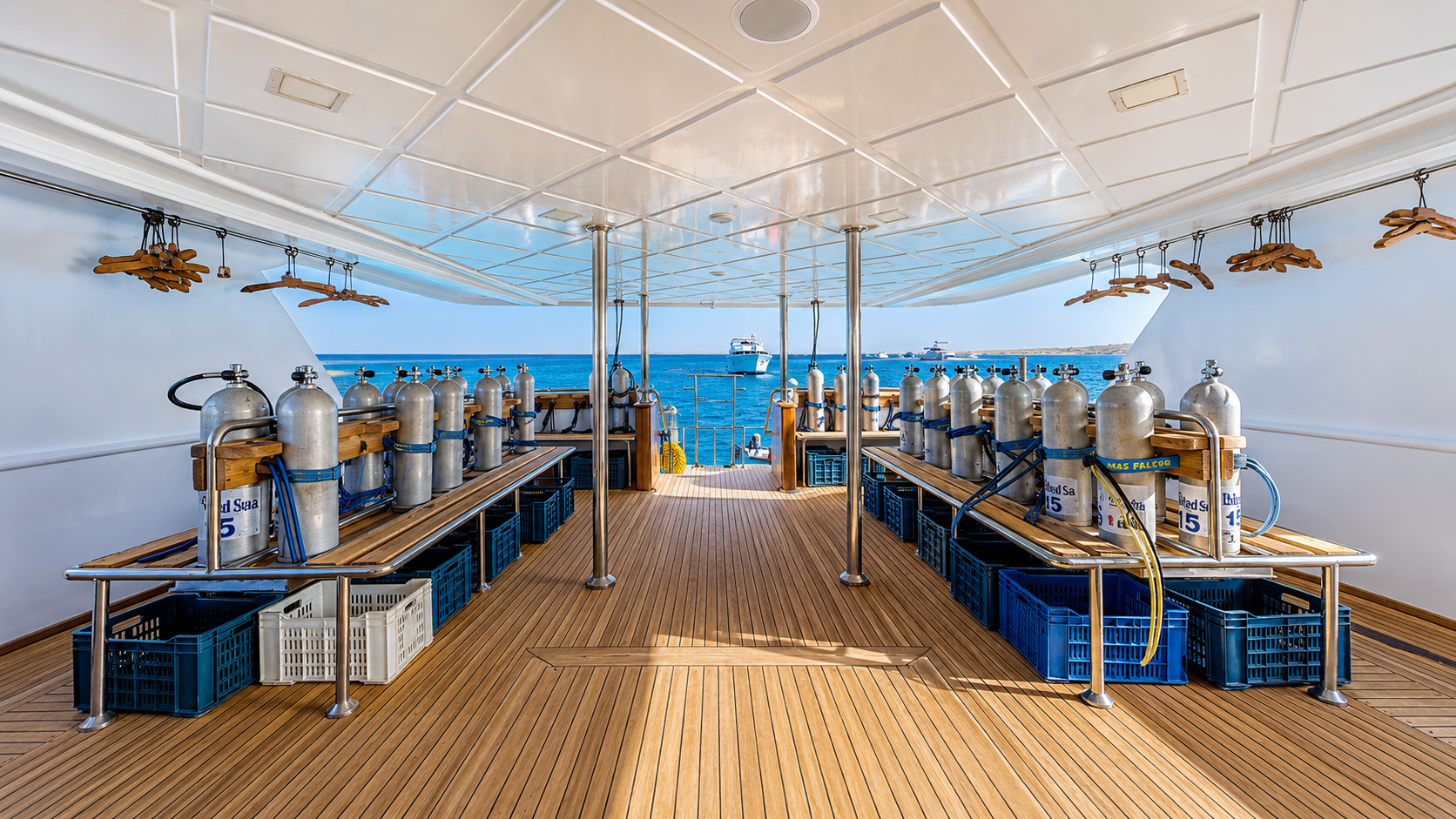 Dive deck with individual gear stations and tank racks