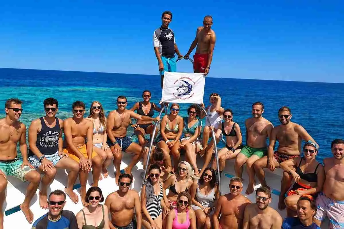 A group of divers together on the deck of a Red Sea Diving liveaboard