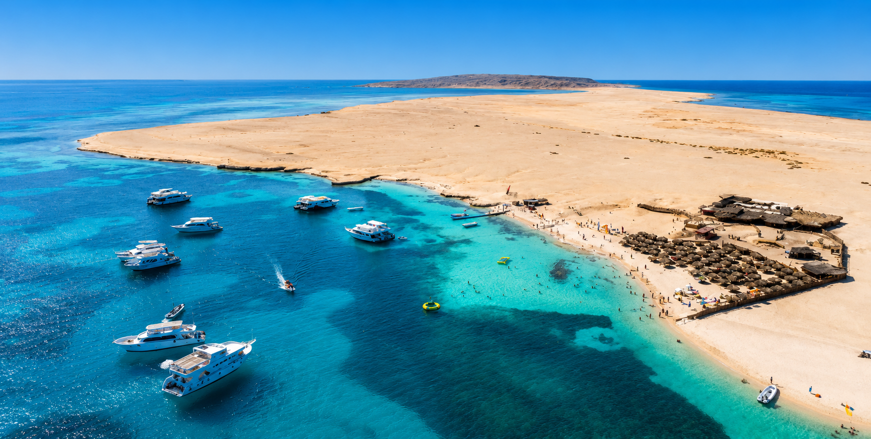 Aerial view of a Giftun Island beach stop with turquoise lagoons and excursion boats near Hurghada