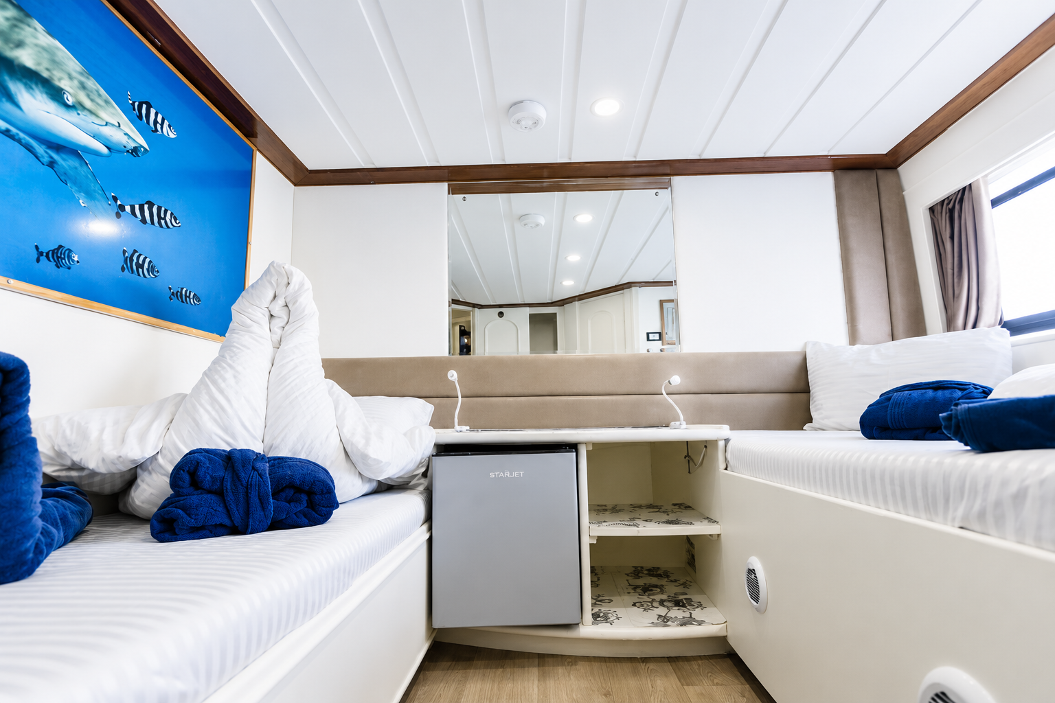 Main deck cabin with natural light and a private bathroom