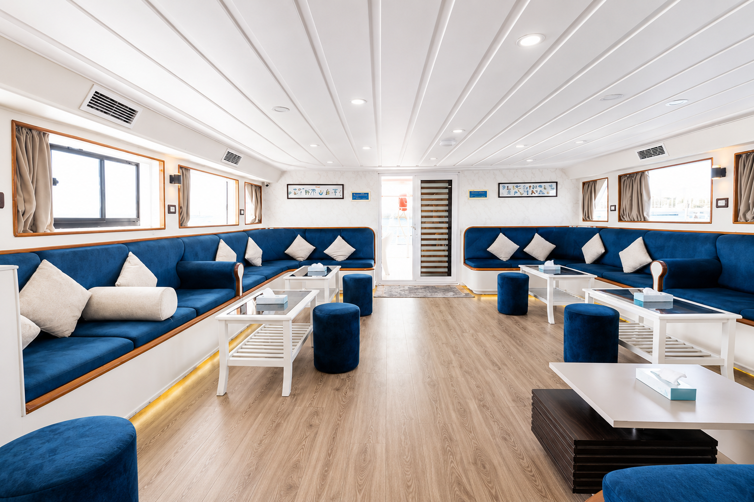 Air-conditioned salon with perimeter seating and wide windows