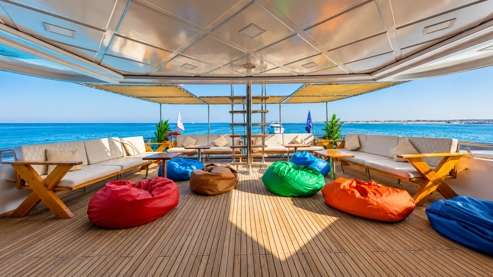 Main sun deck of the C U Red Sea liveaboard with loungers and bean bags
