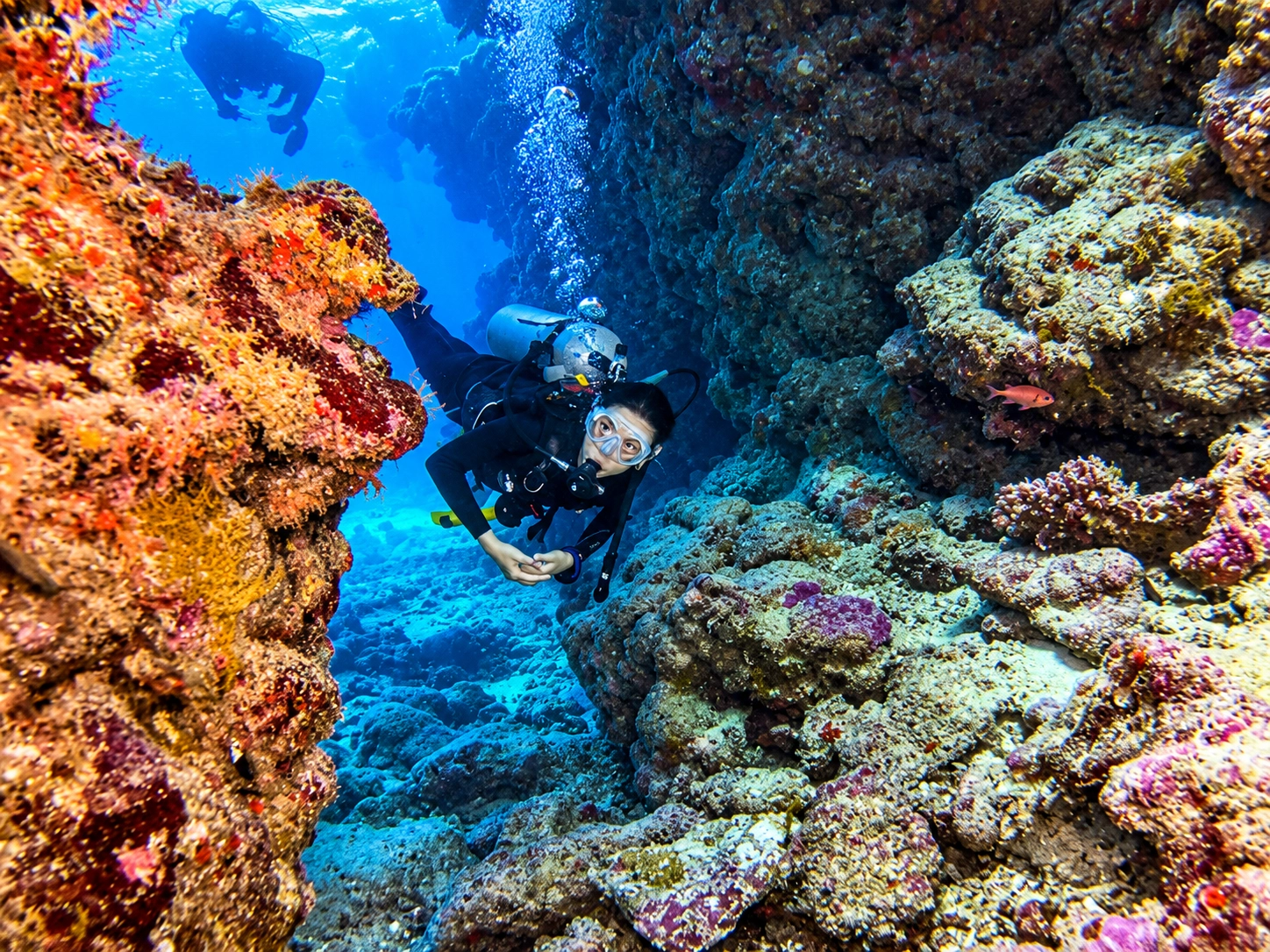 Advanced Open Water diver exploring a reef canyon in Hurghada