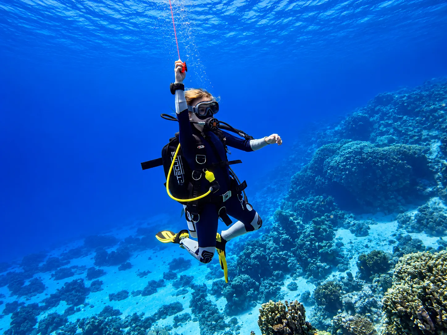 Scuba diver holding a safety stop at the end of a training dive in the Red Sea
