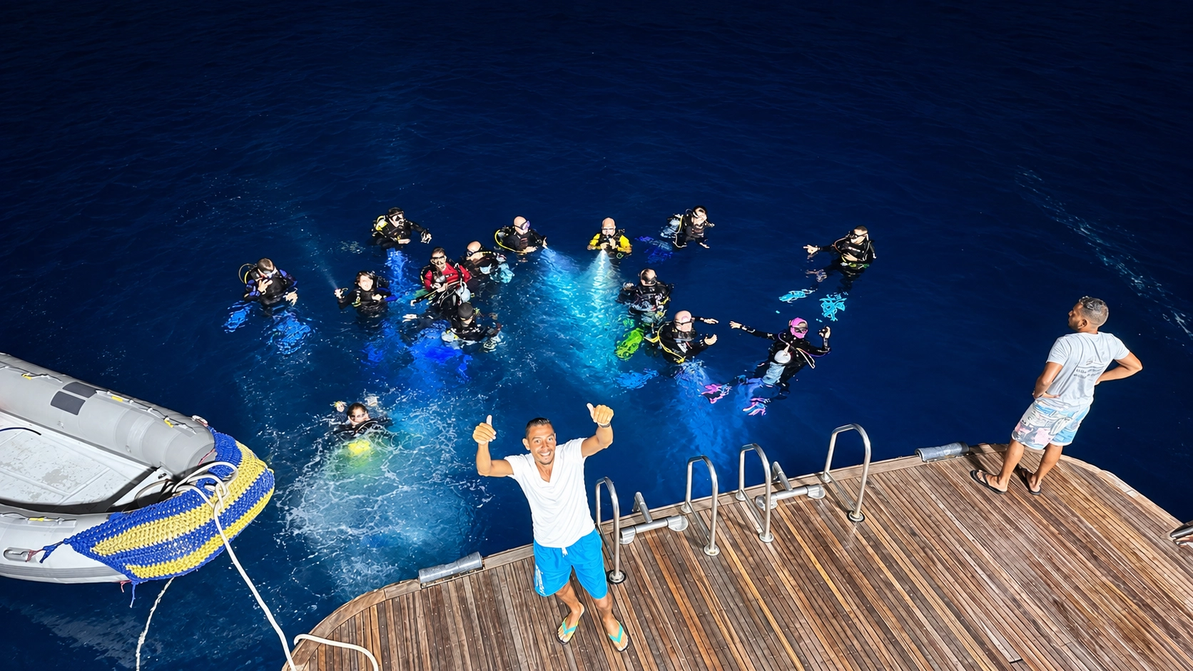 Buddy team entering the water with lights