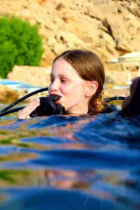 A child's first ocean scuba experience in Egypt