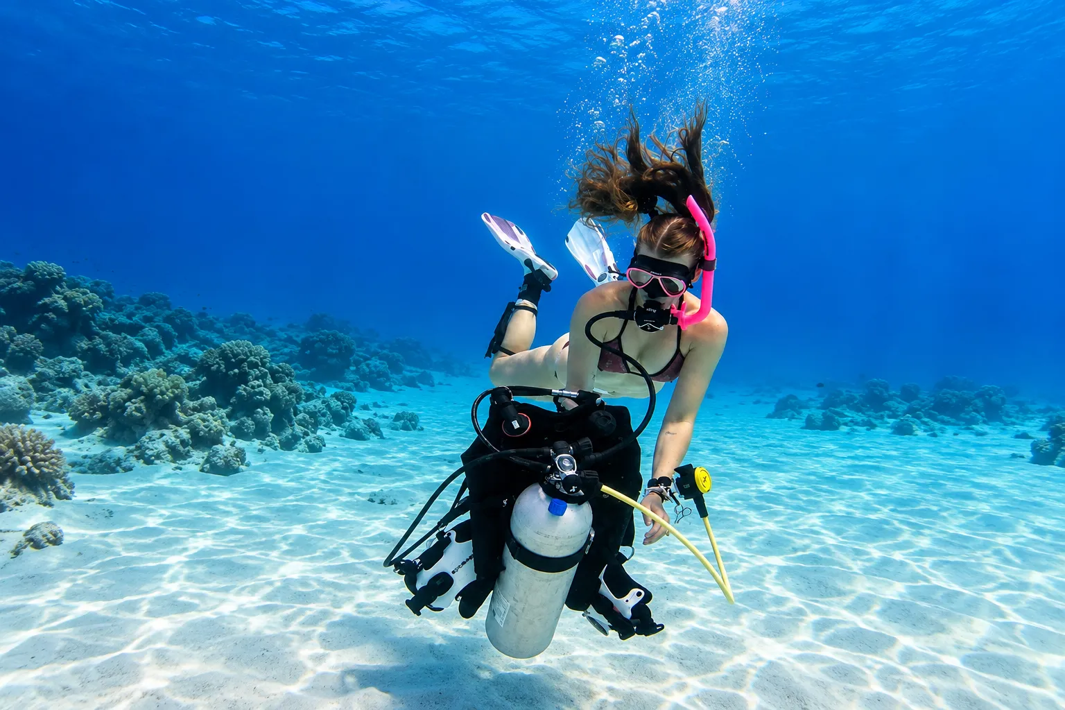 Diver refitting the scuba unit during a training session in Hurghada