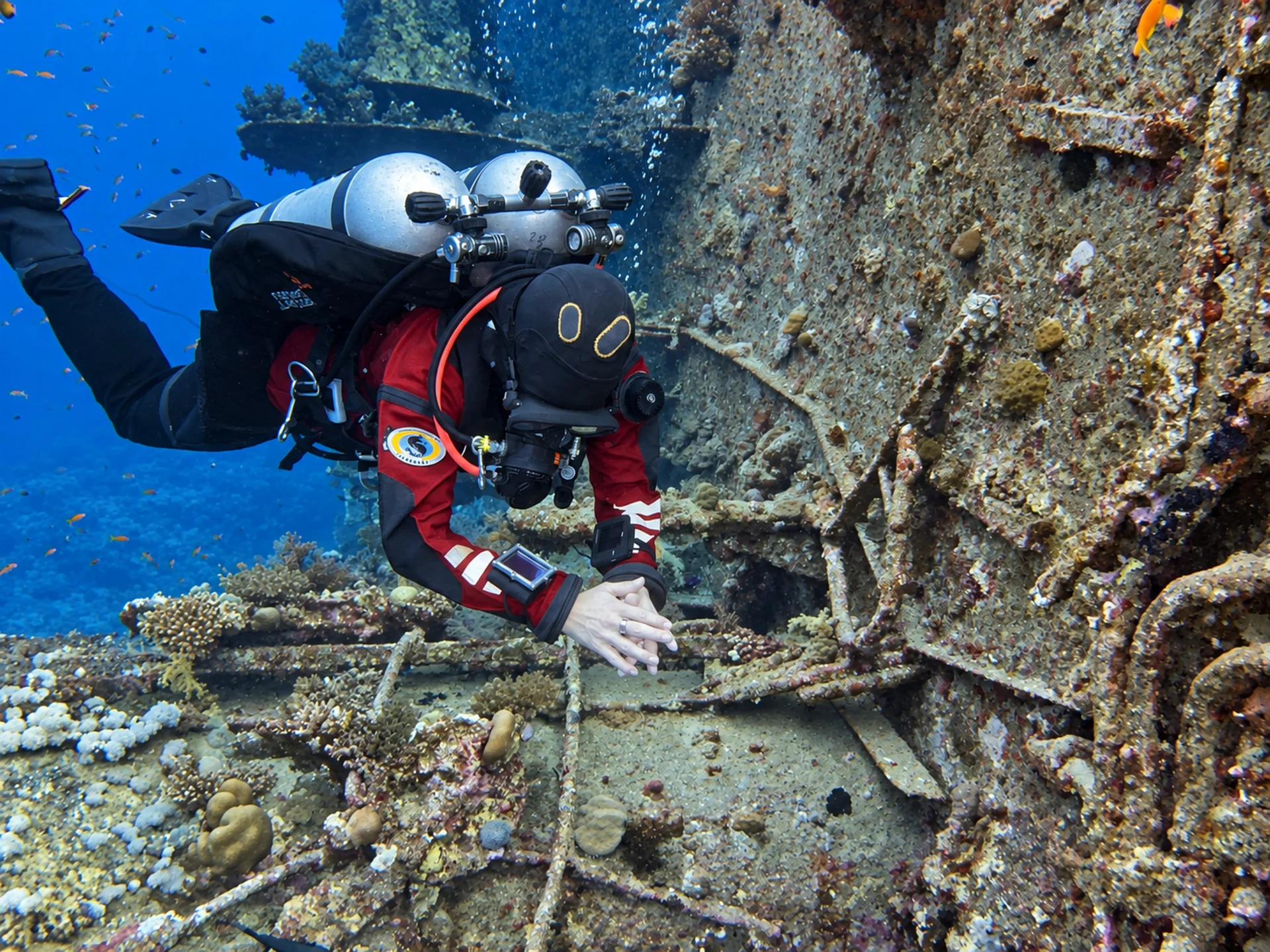 Twinset diver exploring a Red Sea shipwreck below recreational limits