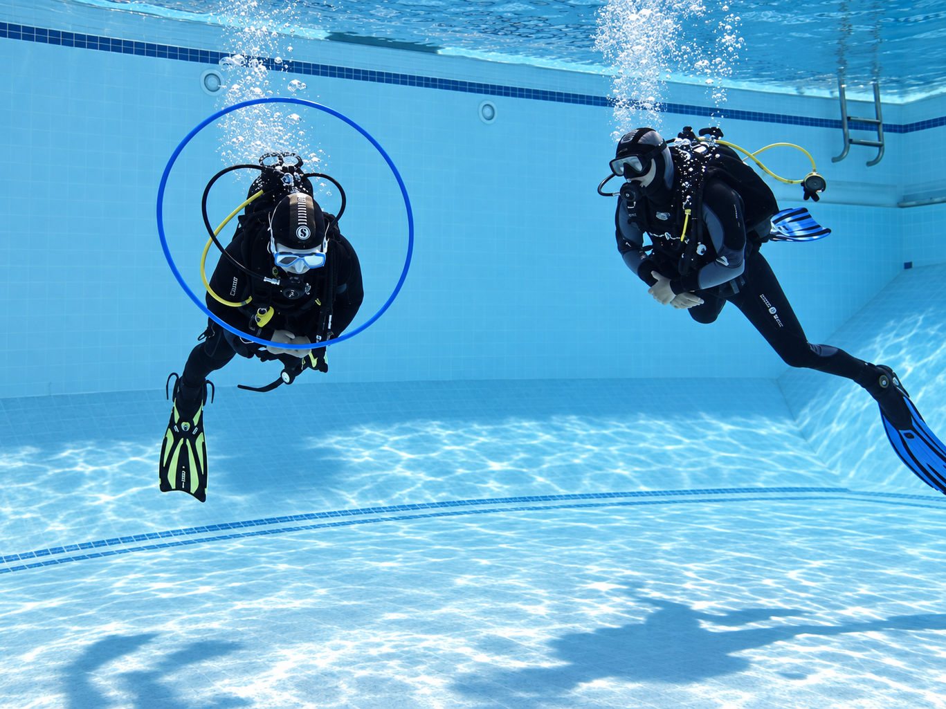 Two students on a PADI Peak Performance Buoyancy challenge