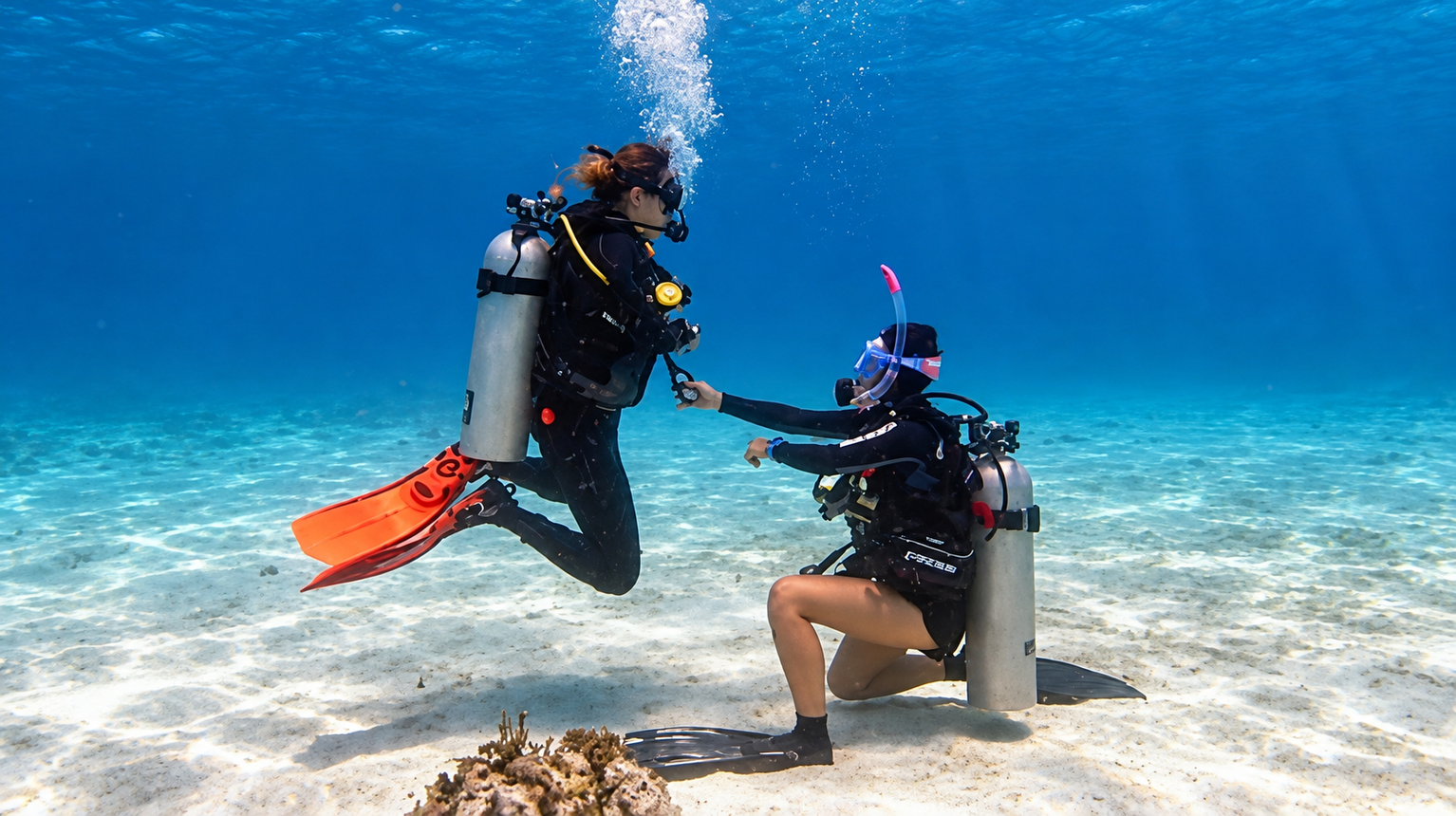 Two divers together on the sand in Hurghada