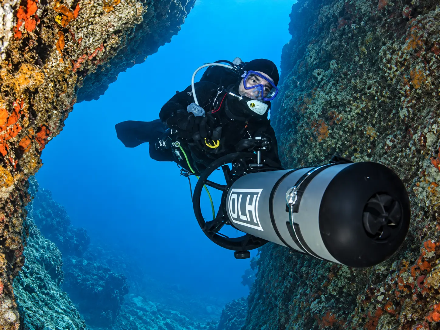 PADI DPV Scooter Diver course student exploring a Red Sea wall